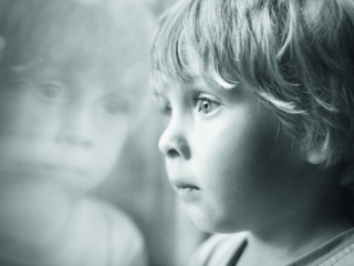 Little boy looking through window.; Shutterstock ID 154732991; Purchase Order: -