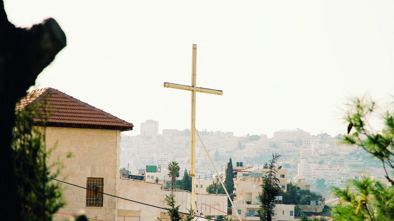 Wooden cross with Jerusalem housing in the distance; Shutterstock ID 1419373955; Purchase Order: -