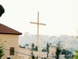 Wooden cross with Jerusalem housing in the distance; Shutterstock ID 1419373955; Purchase Order: -