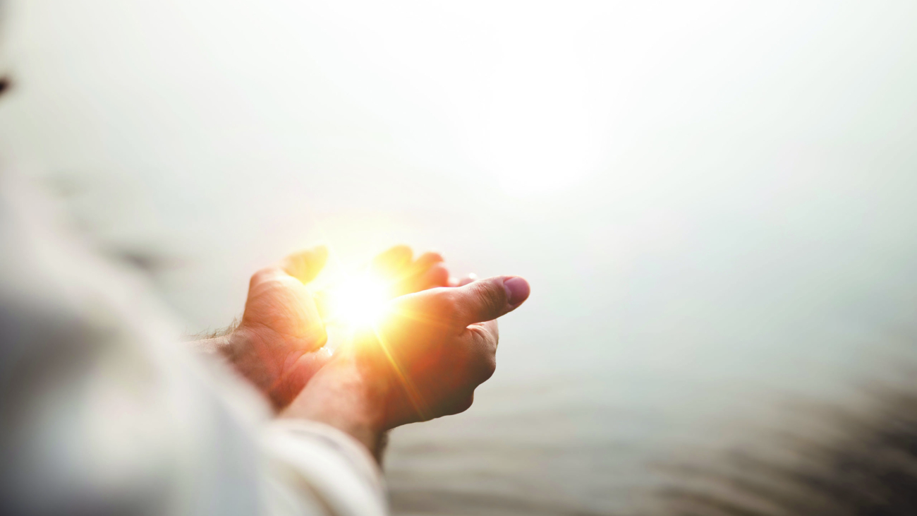 A beautiful shot of Jesus Christ holding hope and light in his palms with a blurred background; Shutterstock ID 1540652960; Project: -