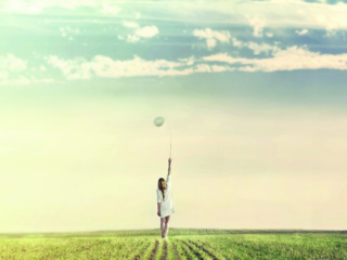 dreamy woman walking towards infinity with his white balloon in nature; Shutterstock ID 629054375; Purchase Order: -